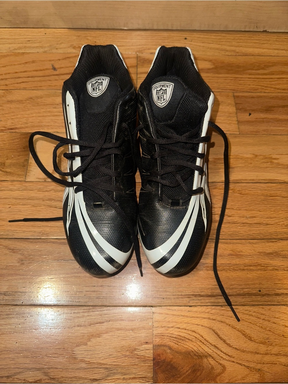 Reebok Men’s Black and White Football Cleats (with the original box damaged)